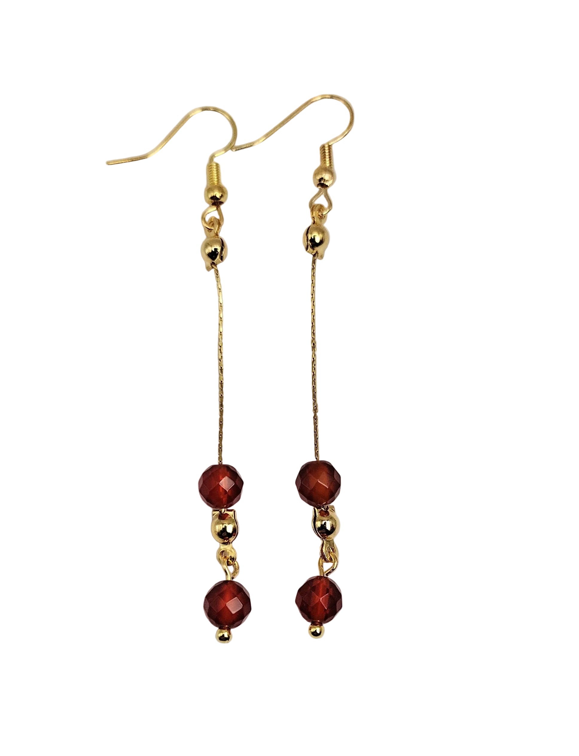 Gold-plated dangle earrings with deep red agate faceted beads on a white background.