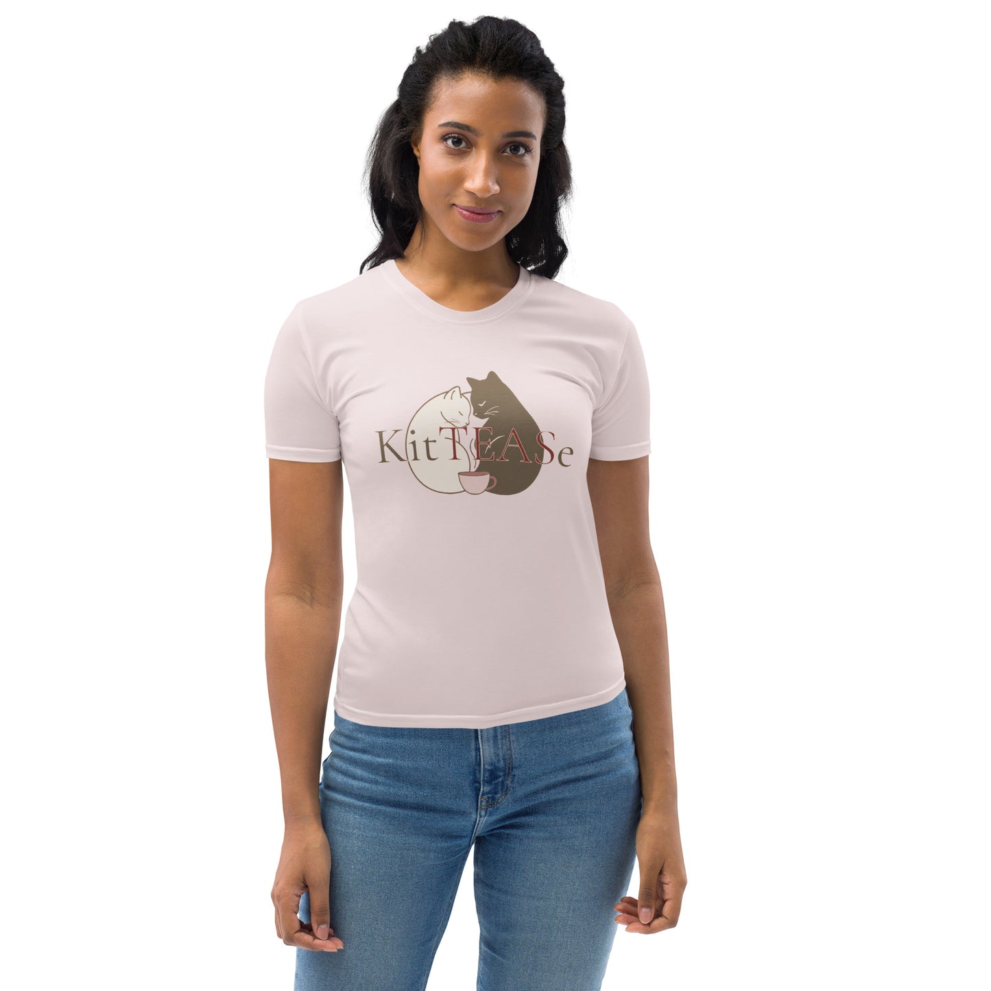 Front view of woman wearing light pink t-shirt with cat, coffee cup, and nap-themed graphic design