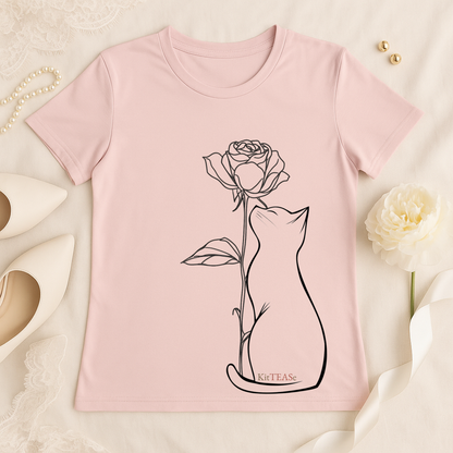 Flat lay of pink t-shirt featuring minimalist cat line art design on chest