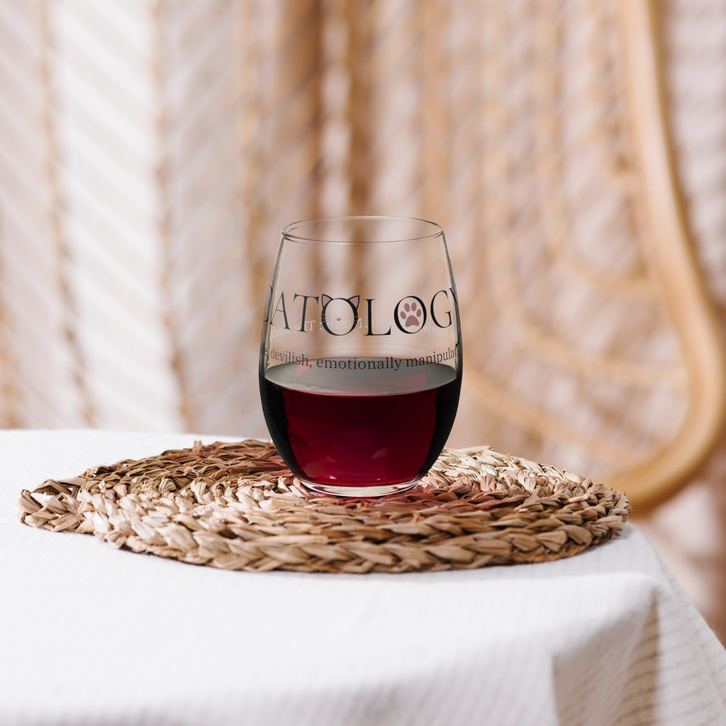 Close-up of Catology stemless wine glass with red wine on woven coaster